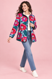 Veste matelassée turquoise à col montant | Vue en mouvement | Lounelle Paris