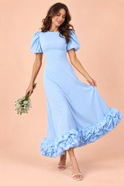 Robe longue bleu clair à manches bouffantes et volant | Vue en mouvement | Lounelle Paris