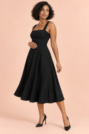 Robe midi noire à fines bretelles et jupe évasée | Vue de dos | Lounelle Paris