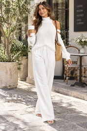 Ensemble pantalon deux pièces oversize blanc à découpe | Photo lifestyle | Lounelle Paris