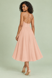 Robe midi beige à fines bretelles et jupe ample | Vue de dos | Lounelle Paris