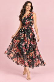 Robe longue fleurie noire à une épaule, coupe trapèze | Vue en mouvement | Lounelle Paris